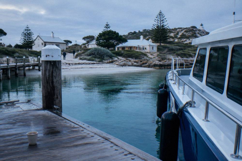 Ferry moored at a jetty on Rottnest Island on a calm morning