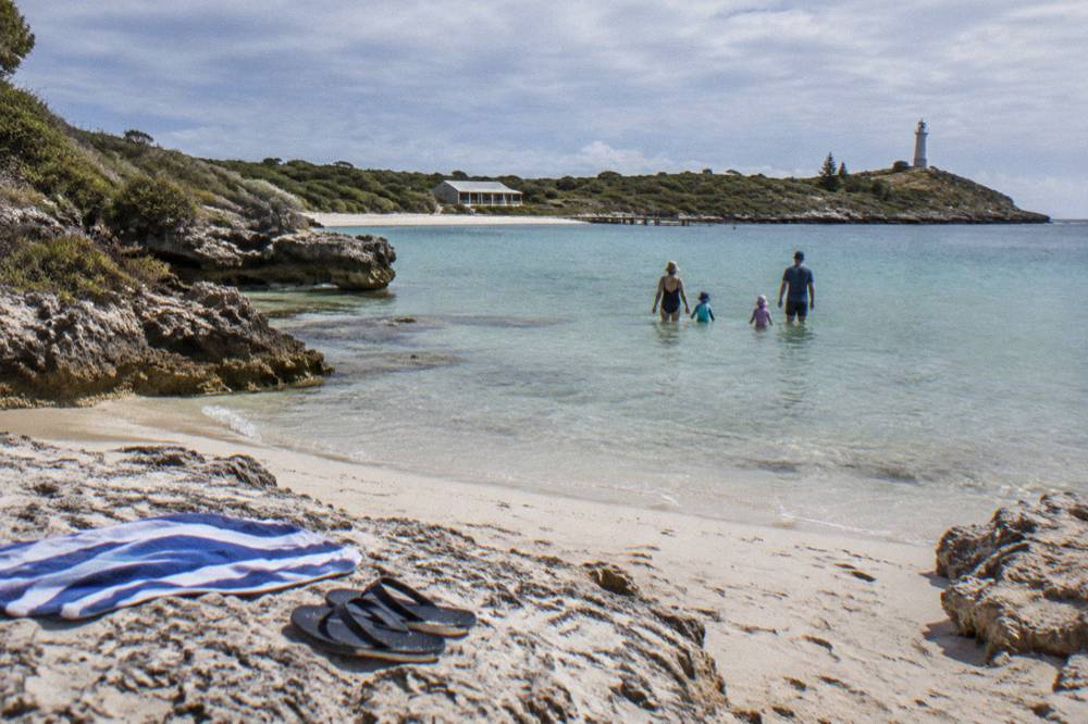 Families walking with young children along the Thomson Bay shoreline on Rottnest Island