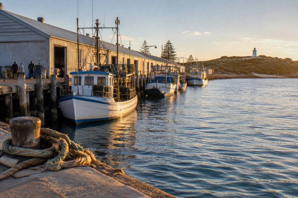 Fishing boats and wharf buildings along Victoria Quay in Fremantle harbour