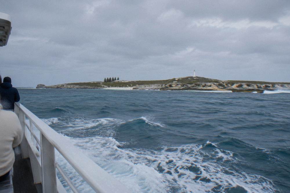 Ferry crossing open water with whitecaps and the Rottnest coastline on the horizon