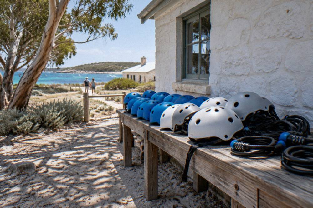 Rows of hire bicycles parked outside a low timber building in the Thomson Bay settlement